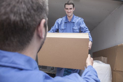 Flat removals planning in Finsbury Park with a moving van and packed boxes