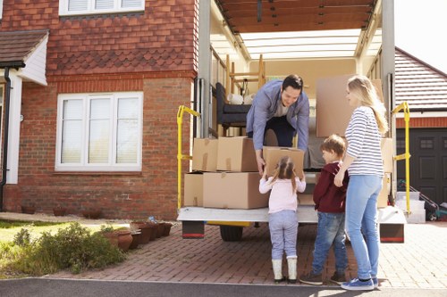 Removal van and moving team in a Finsbury Park residential street
