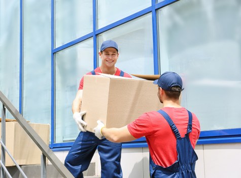 Packed office furniture and equipment ready for relocation in North London