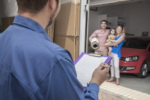 Staff using PPE during a careful house move