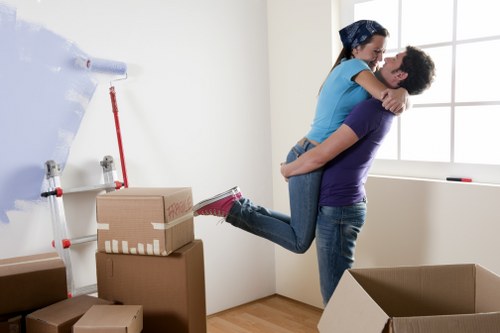 Piano movers navigating stairs and tight access in a Finsbury Park property