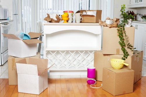 Organised office boxes and IT equipment prepared for relocation