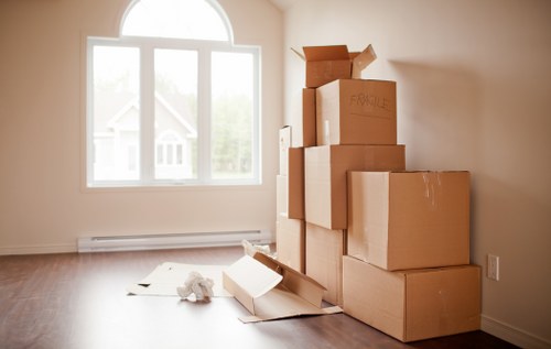 Furniture and boxes being transported by a local van service