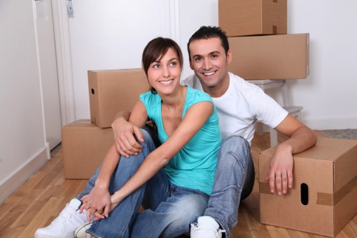 Staff moving desks and office furniture during a relocation