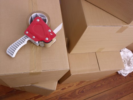 Movers loading household items for transport in North London