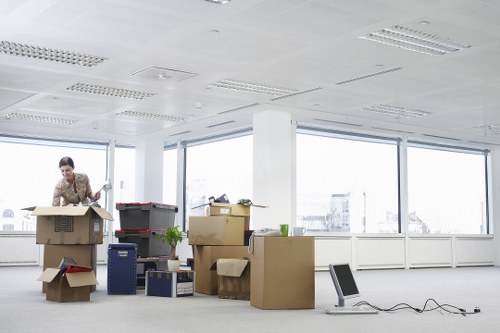 Office furniture being moved carefully through a Finsbury Park building